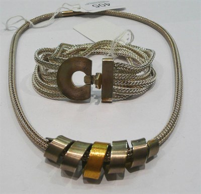 Lot 405 - A contemporary bracelet and necklace, in boxes by Robert Feather