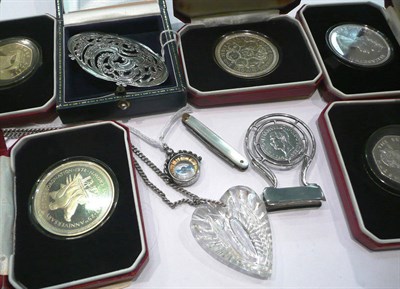 Lot 406 - Coin mounted money clip, Dutch pierced brooch, Waterford crystal heart on a chain, compass pendant