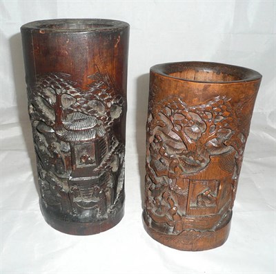 Lot 425 - Two stained and carved hardwood vases