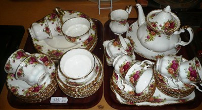 Lot 434 - Royal Albert Country roses tea/dinner service with teapot, on two trays