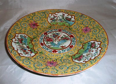 Lot 436 - Yellow ground Chinese circular plate with famille rose decoration
