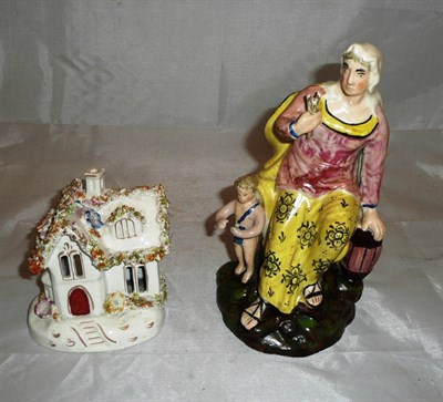 Lot 437 - An early 19th century Staffordshire figure group and a cottage pastille burner
