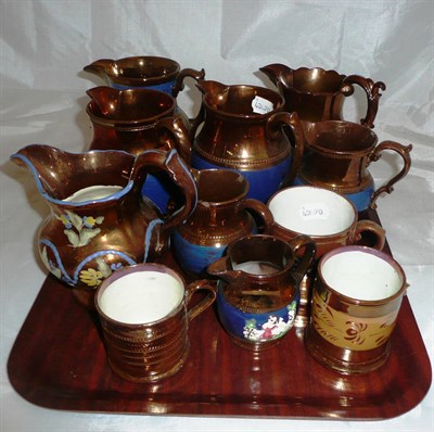 Lot 460 - Eleven copper lustre jugs and mugs