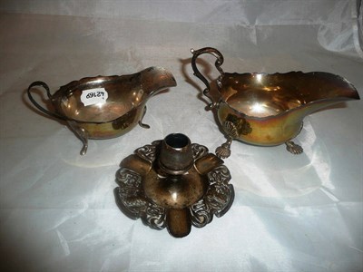 Lot 478 - Two silver sauce boats and a silver chamber candlestick