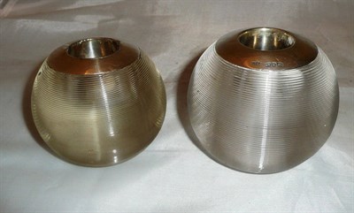 Lot 479 - Two large glass matchballs with silver mounts