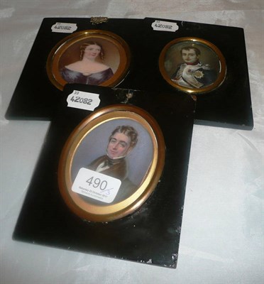 Lot 490 - Three portrait miniatures in ebonised frames
