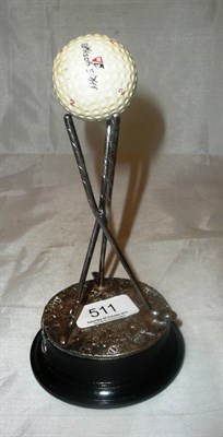 Lot 511 - A white metal mounted golf trophy, with ball