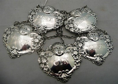 Lot 530 - A set of five silver wine labels, Sherry, Port. Whisky, Brandy, Gin