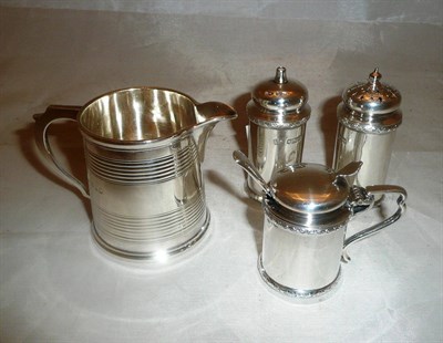 Lot 532 - A three piece cruet set and a Victorian cream jug