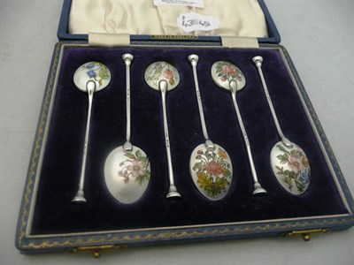 Lot 534 - A set of six silver and enamel coffee spoons