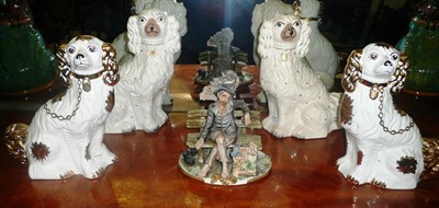 Lot 547 - A pair of Staffordshire Spaniels, a pair of modern examples and a Capo di Monte figure group of...
