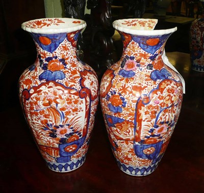 Lot 555 - A pair of Japanese Imari vases