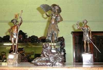 Lot 556 - Pair of reproduction bronzed figures and a reproduction figure of a lady with fan and a resin dog