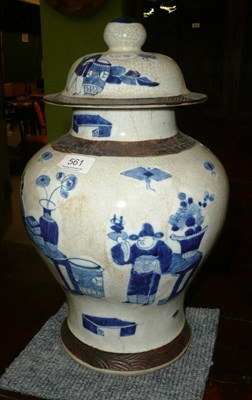 Lot 561 - A late 19th century Chinese blue and white decorated crackleware baluster vase and cover