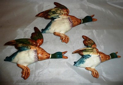Lot 580 - Set three Beswick flying ducks