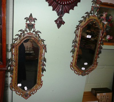 Lot 640 - A pair of Italian carved and painted mirrors