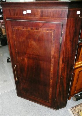 Lot 651 - A 19th century mahogany straight front hanging corner cupboard
