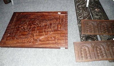 Lot 659 - Carved figural plaque, four carved oak panels and a mahogany cornice