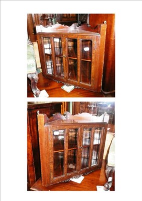 Lot 660 - Pair of glazed corner cupboards (from a larger piece)