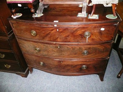 Lot 675 - A late George III mahogany bow front chest 105cm x 52cm x 87.5cmb (some alterations and losses)