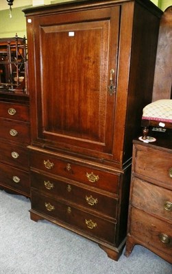 Lot 676 - A oak cabinet on chest