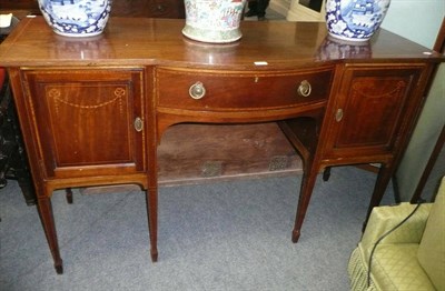 Lot 684 - Mahogany serpentine sideboard