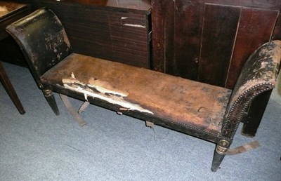 Lot 690 - A leather upholstered window seat