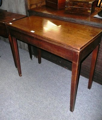 Lot 691 - A George III mahogany rectangular fold-over fly leg games table, 88cm x 44cm x 74cm