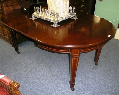 Lot 694 - Dining table, two leaves and winder