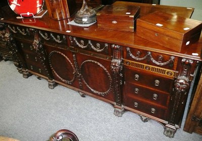 Lot 696 - A reproduction 'director' Chippendale sideboard