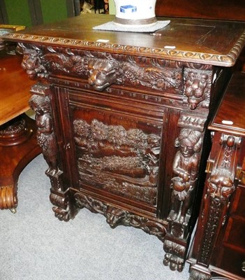 Lot 697 - Carved oak cupboard