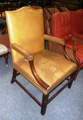Lot 717 - Leather upholstered mahogany elbow chair