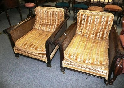 Lot 720 - Pair of mahogany double cane burgere elbow chairs