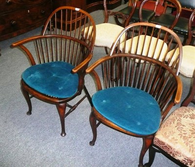 Lot 721 - A pair of stick-back armchairs with caned seats and squabs