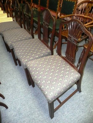 Lot 723 - A set of four Georgian carved mahogany dining chairs