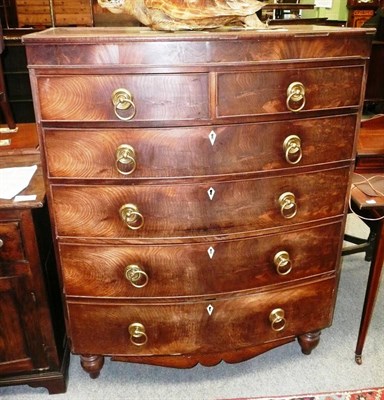 Lot 739 - A mahogany bow fronted five height chest of drawers