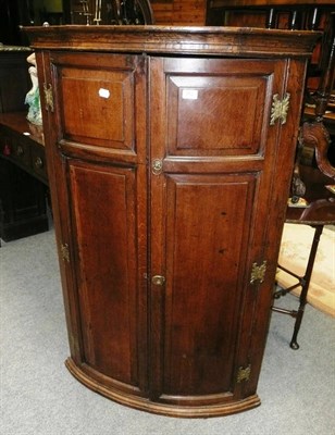 Lot 753 - George III oak corner cupboard