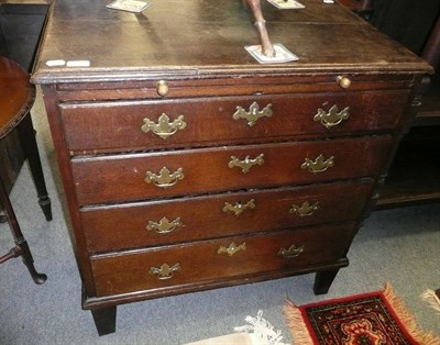 Lot 757 - An 18th century oak four height chest with brushing slide