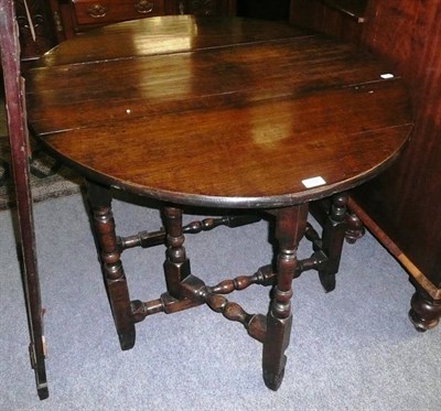 Lot 762 - An 18th century oak drop-leaf table