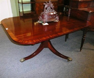 Lot 797 - A 19th century mahogany and rosewood snaptop supper table