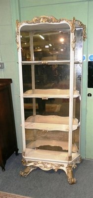 Lot 816 - 19th century white painted and gilt mirror back open shelves