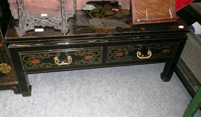 Lot 891 - An oriental black lacquered low table with two frieze drawers