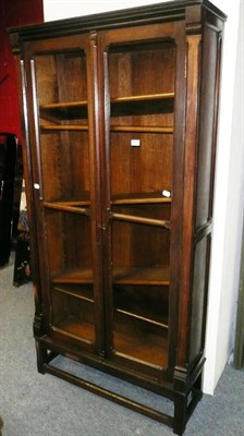 Lot 895 - A glazed oak bookcase