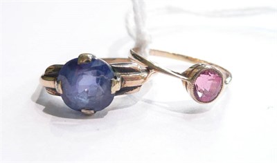 Lot 14 - A blue sapphire ring (stone scuffed) and a pink coloured spinel ring