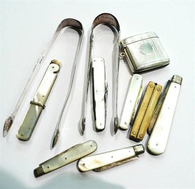 Lot 21 - Six mother of pearl fruit knives with silver blades, a vesta case, two silver tongs etc