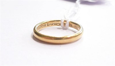 Lot 57 - A 22ct gold band ring