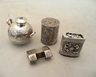 Lot 65 - A Chinese white metal vesta case, a cylindrical white metal canister, a small twin handled vase and