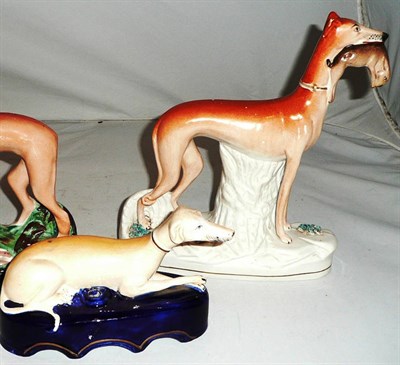Lot 79 - A Staffordshire greyhound quill holder a standing greyhound with hare