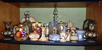 Lot 100 - A shelf of decorative ceramics and glass including Torquay pottery Motto Ware, Wedgwood blue jasper