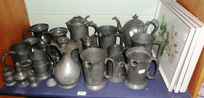 Lot 102 - A collection of pewter baluster measures, quart measures, pair of candlesticks, pepperette etc...